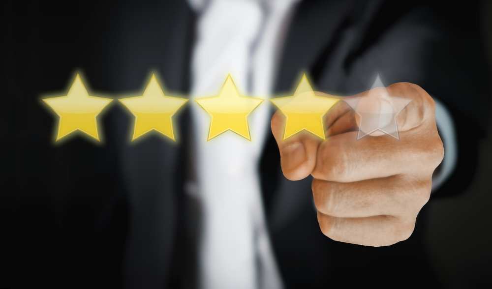 A close-up of a person leaving a customer review on a mobile device, sharing feedback about a product or service.