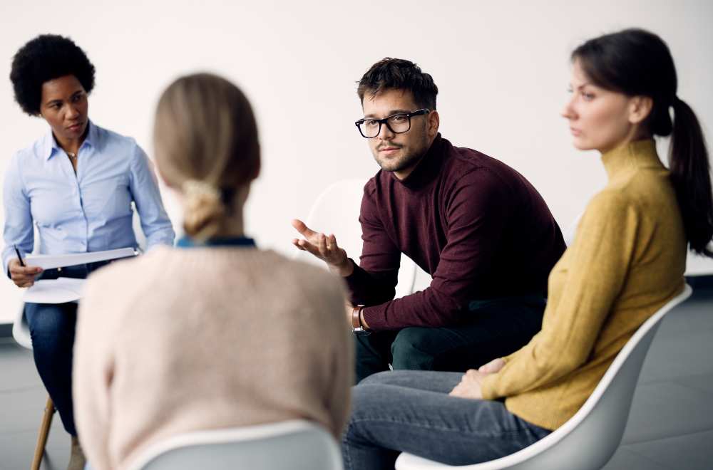 A depiction of a focus group in action with participants sharing insights and a moderator leading the discussion, showcasing the process of gathering qualitative data.